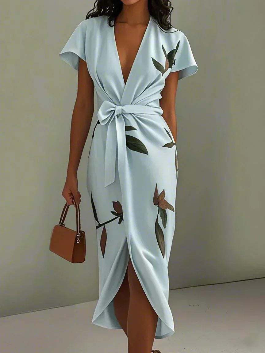 Light blue wrap dress with V-neck, short sleeves, tie waist, bird-and-leaf print