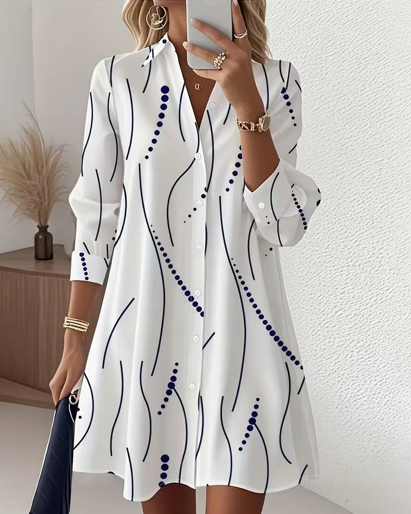 Women's white wavy-collar shirt with long sleeves, navy abstract lines and blue dot motifs