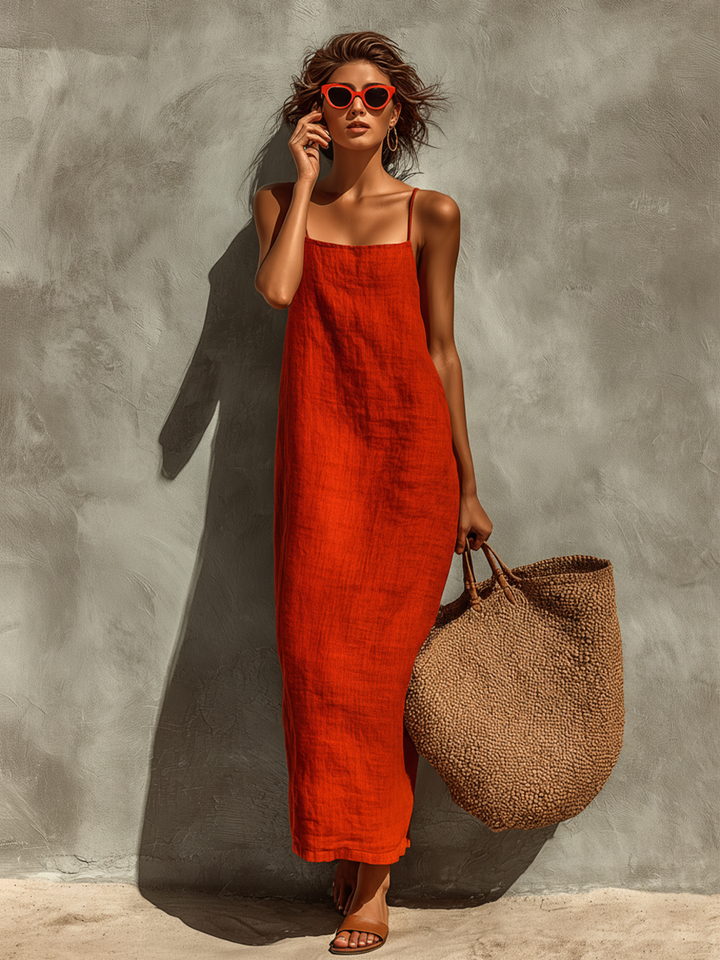 Red sleeveless midi dress with square neckline and thin spaghetti straps, textured fabric