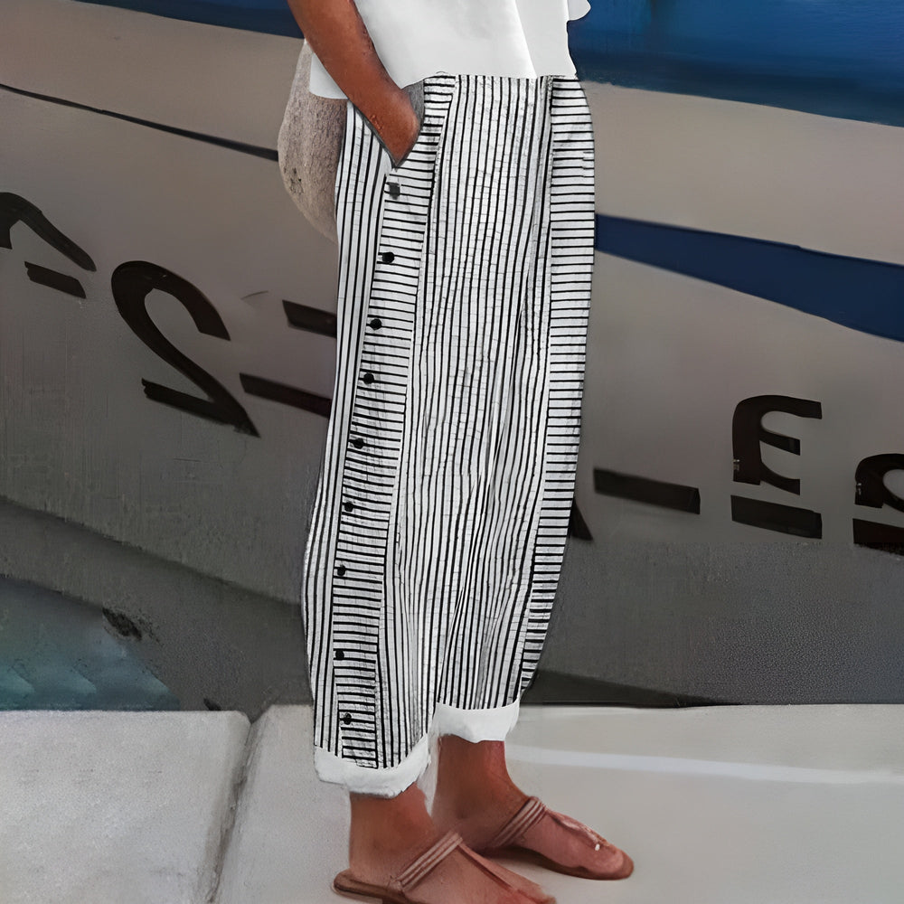 Black-and-white striped trousers with button-front detail, wide leg