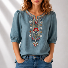 Denim blue embroidered floral blouse with puff sleeves and colorful V-neck detail