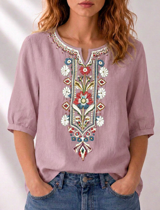Dusty pink embroidered floral blouse with puff sleeves and ornate V-neck placket