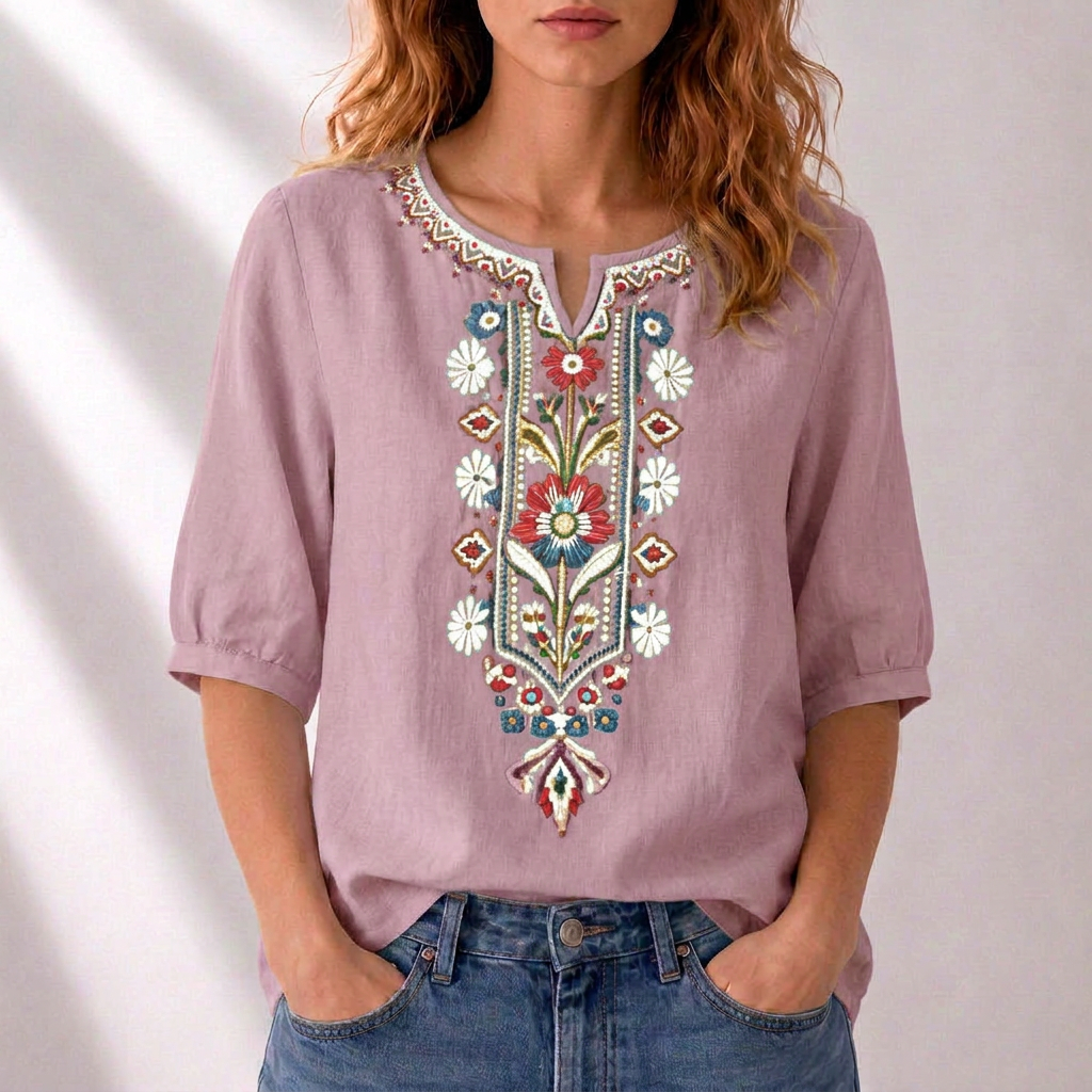 Dusty pink embroidered floral blouse with puff sleeves and ornate V-neck placket