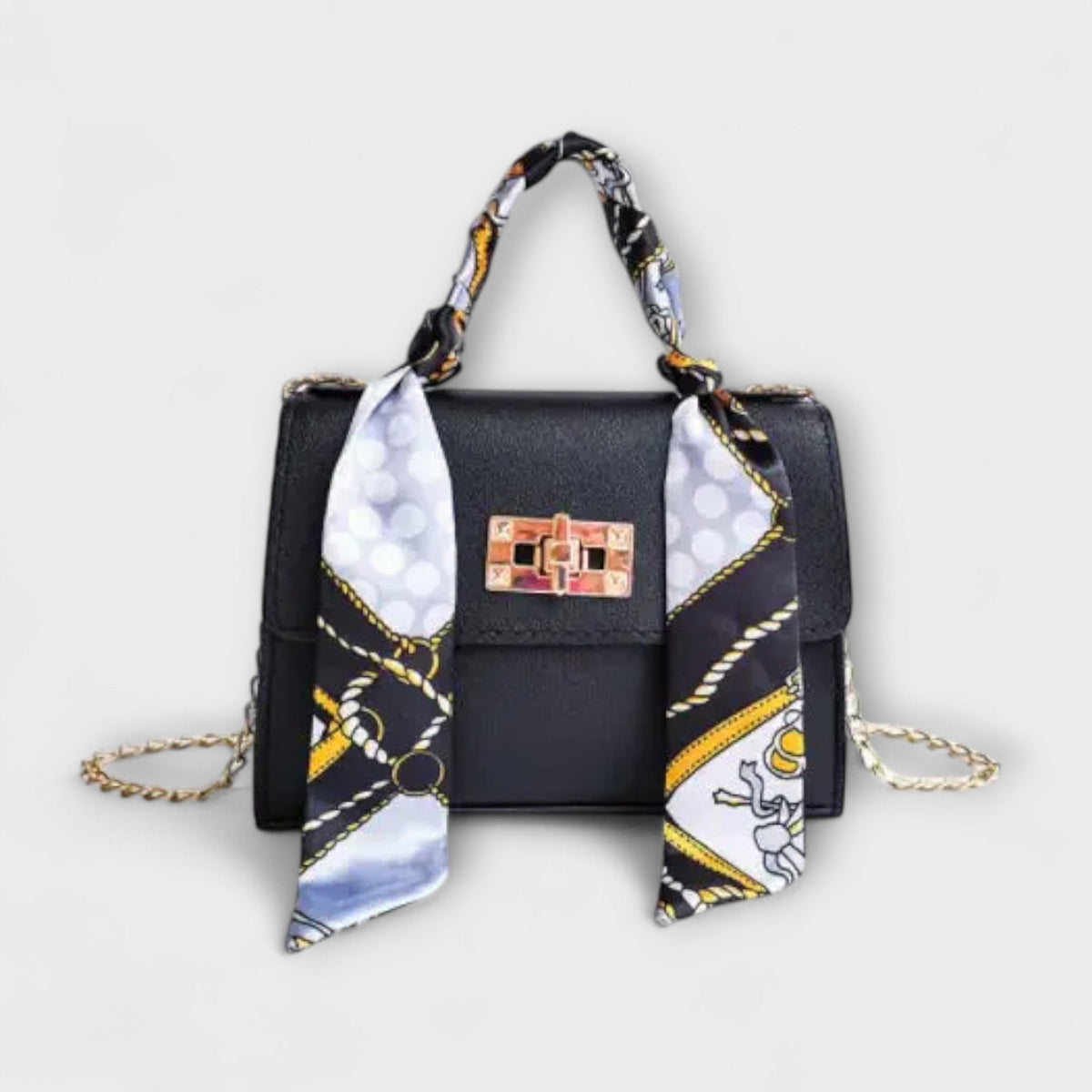 Black handbag with gold clasp, chain strap, and patterned scarf handle