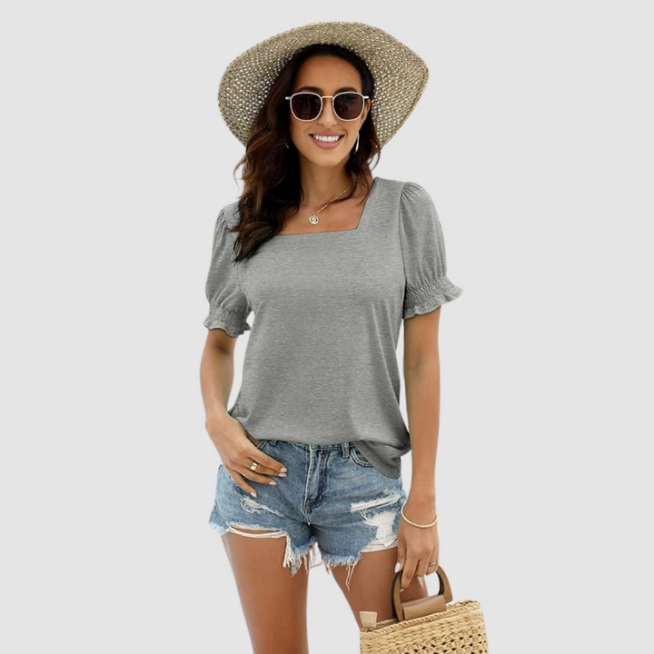 Gray square-neck blouse with short puff sleeves and gathered cuffs.