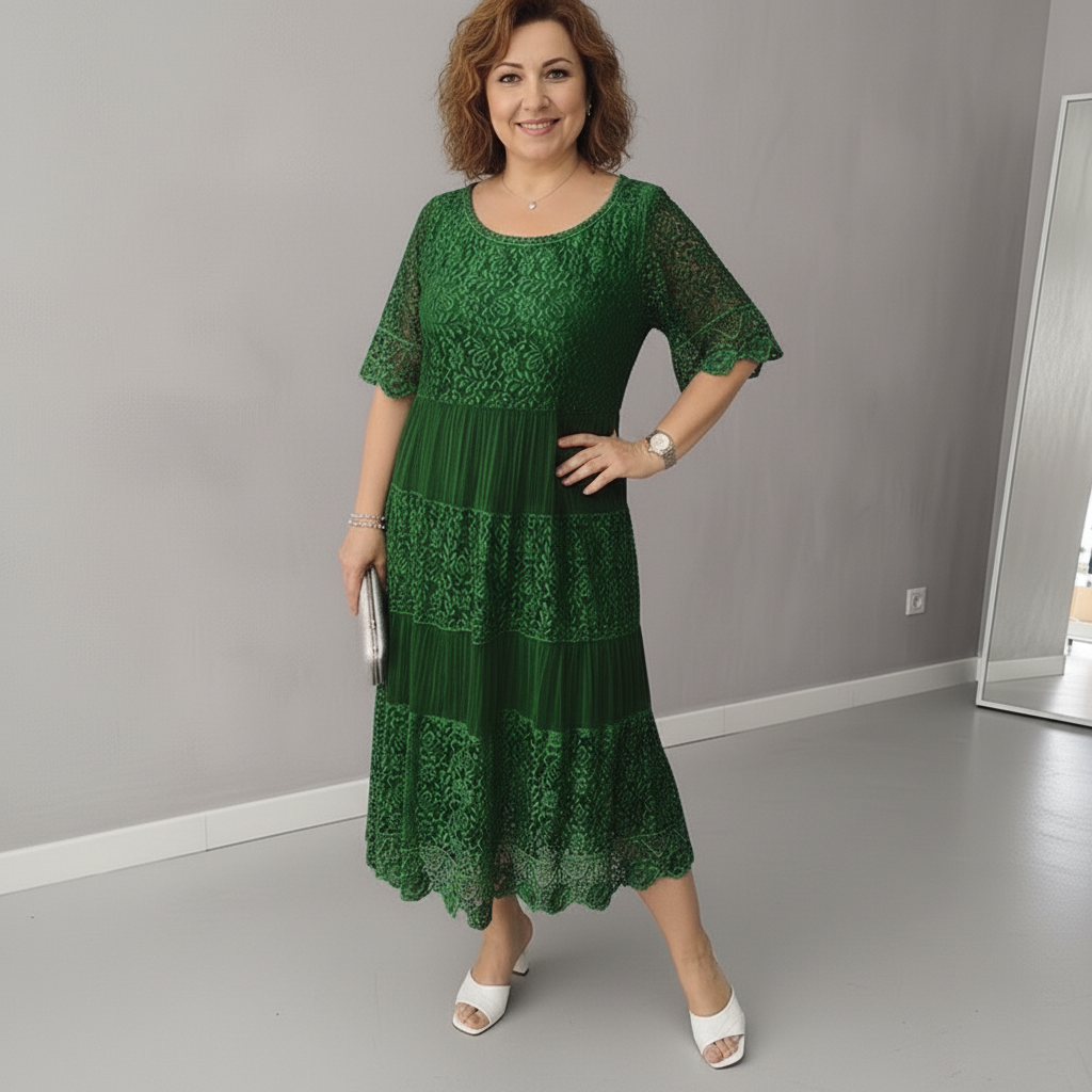 Green lace tiered midi dress with flutter sleeves and textured lace bodice