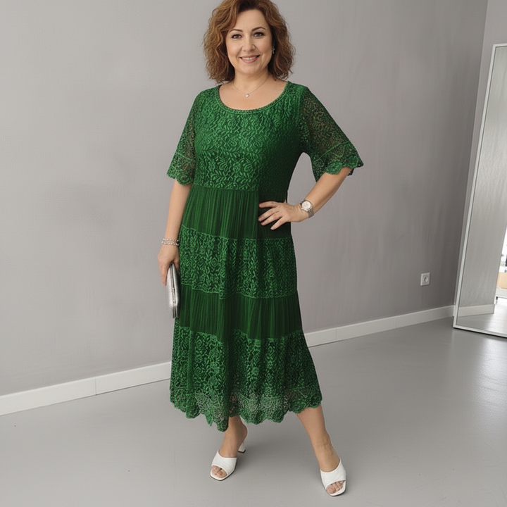 Green lace tiered midi dress with flutter sleeves and textured lace bodice