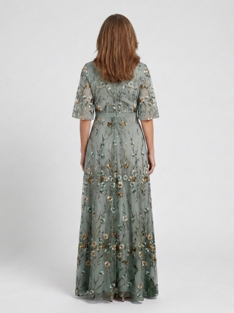 Sage green floral V-neck maxi dress, back view with gathered tiers