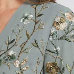 Sage green floral embroidery on the maxi dress bodice and shoulder