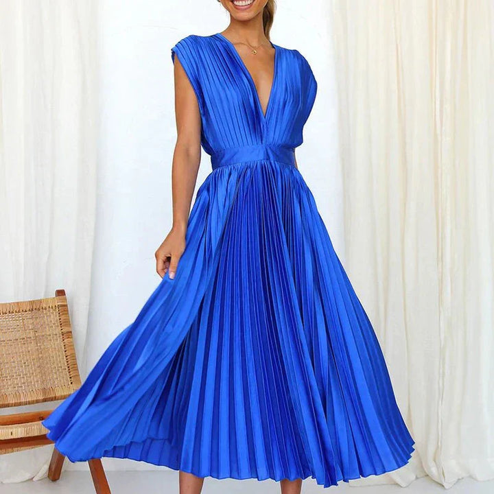 Royal blue pleated midi dress with V-neck, short sleeves, and gathered waist