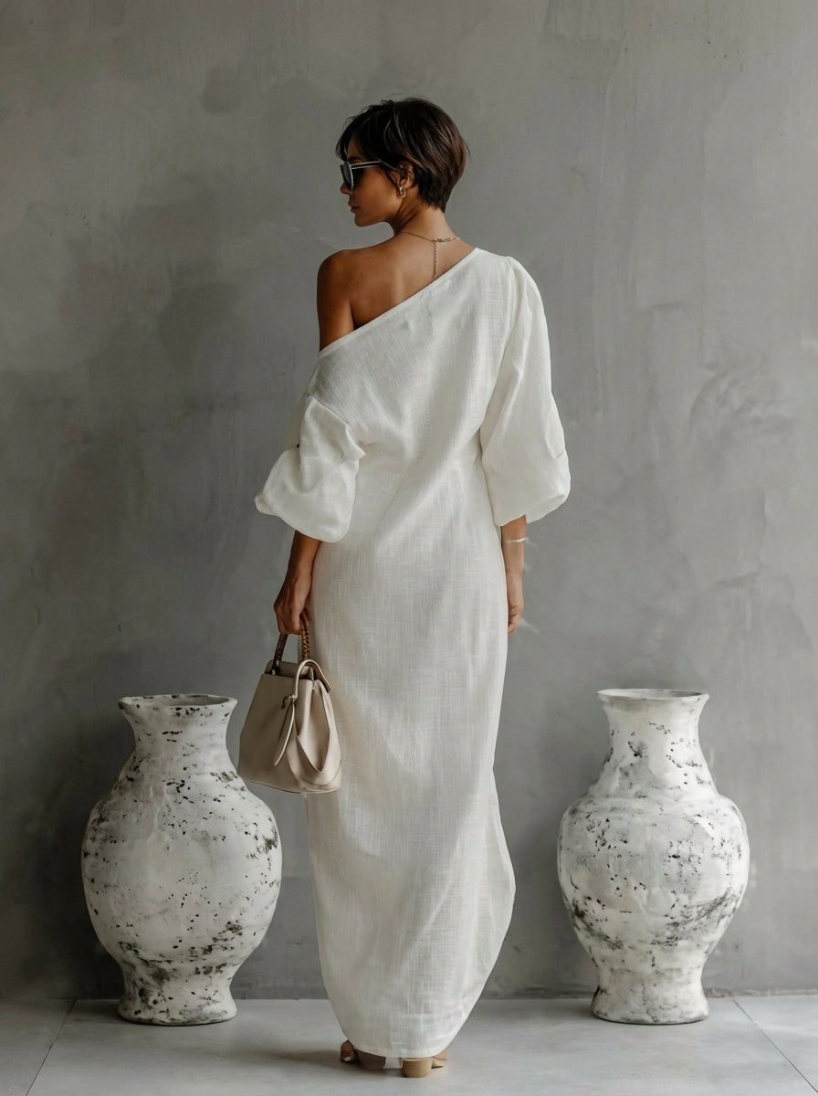 White one-shoulder maxi dress with draped sash, loose half sleeves