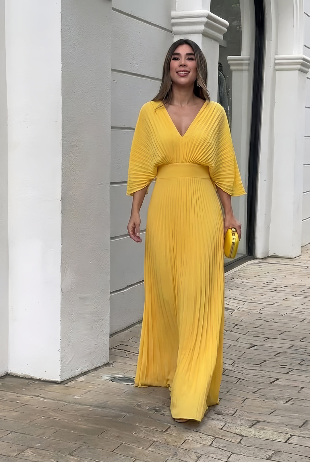 Yellow pleated V-neck maxi dress with gathered waist and three-quarter sleeves