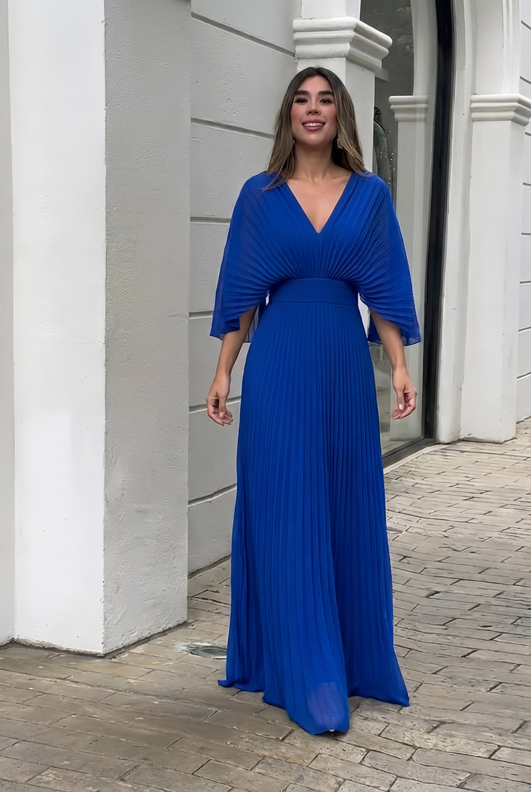 Blue pleated V-neck maxi dress with gathered waist and three-quarter sleeves