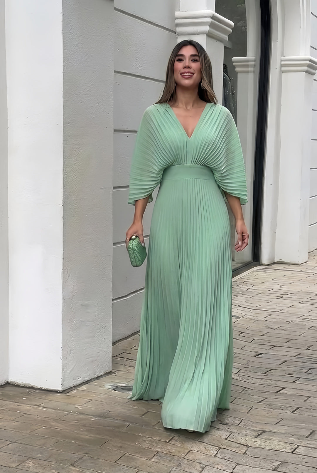 Mint green pleated V-neck maxi dress with gathered waist and three-quarter sleeves
