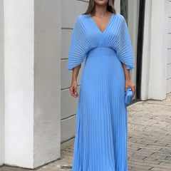 Light blue pleated V-neck maxi dress with gathered waist and flowing skirt