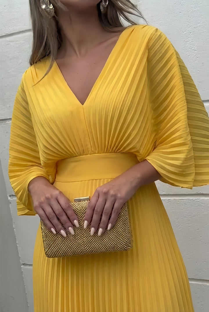 Yellow pleated V-neck maxi dress detail with ruched waist