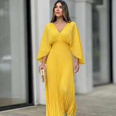 Yellow pleated V-neck maxi dress with gathered waist and flowing skirt