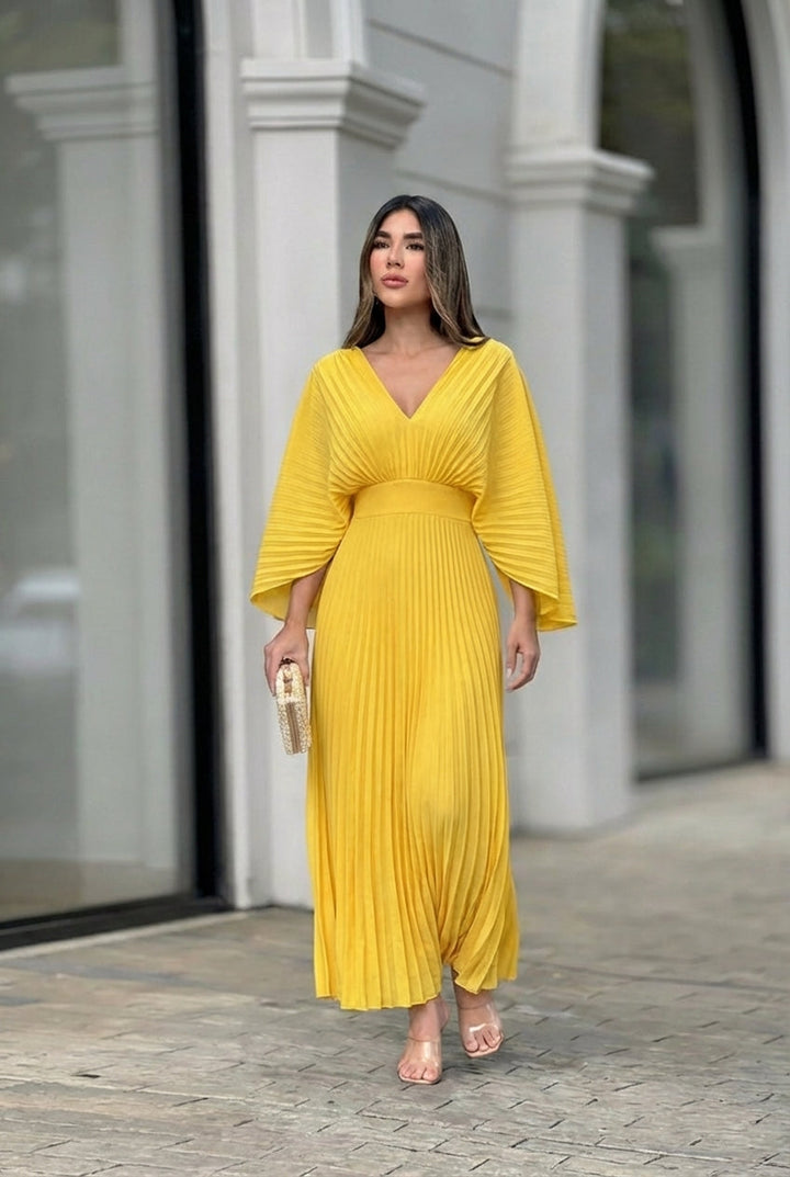 Yellow pleated V-neck maxi dress with gathered waist and flowing skirt
