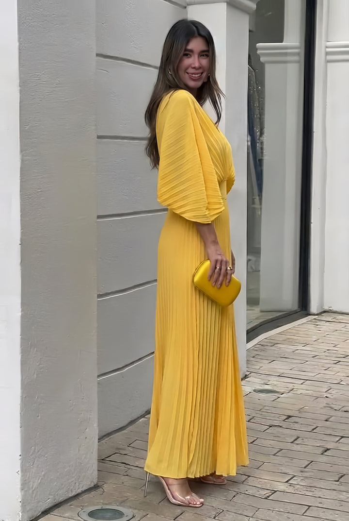 Yellow pleated V-neck maxi dress with three-quarter sleeves, side view