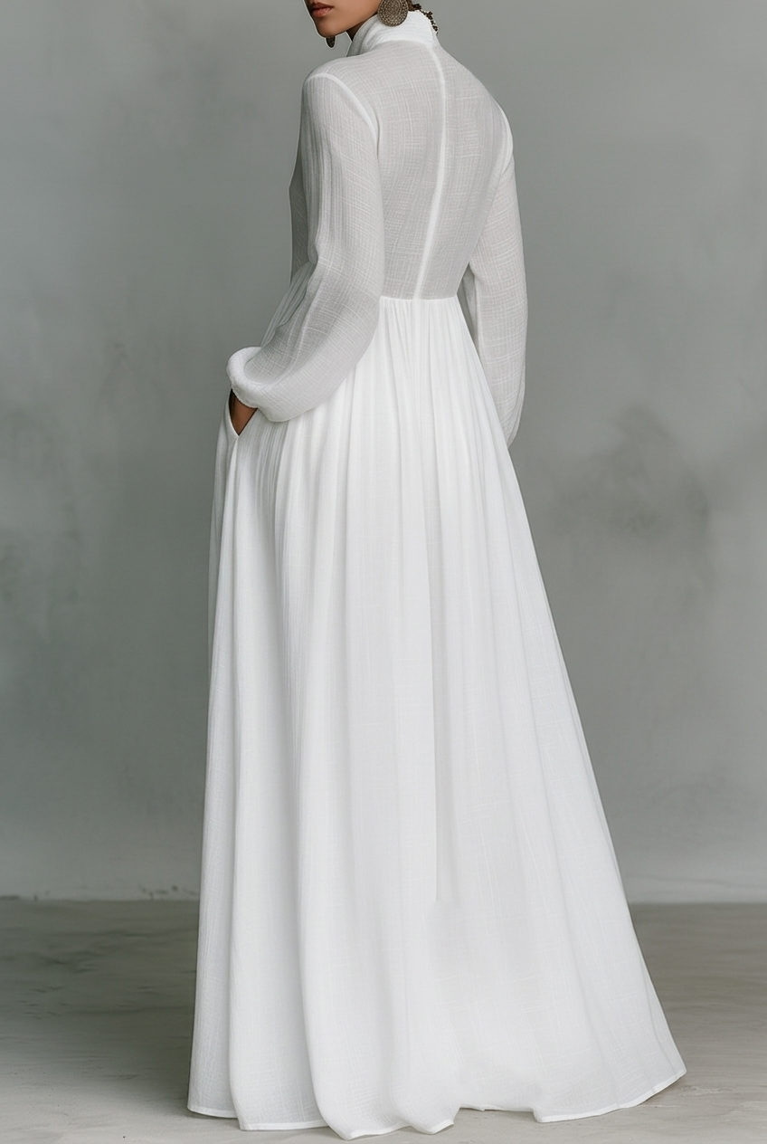 White long-sleeve maxi dress with gathered waist and pleated full skirt (back view)