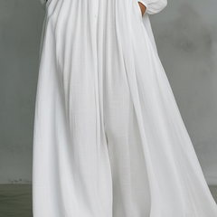 White long maxi dress with V-neck, button placket, gathered waist and flowing skirt