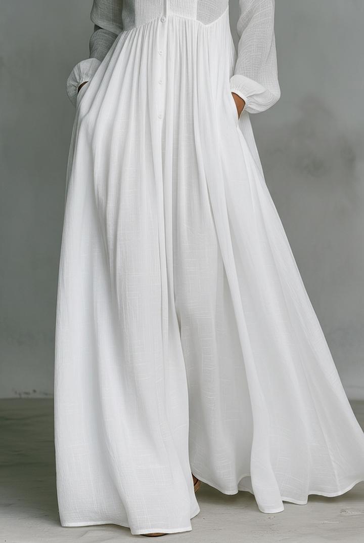 White long maxi dress with V-neck, button placket, gathered waist and flowing skirt