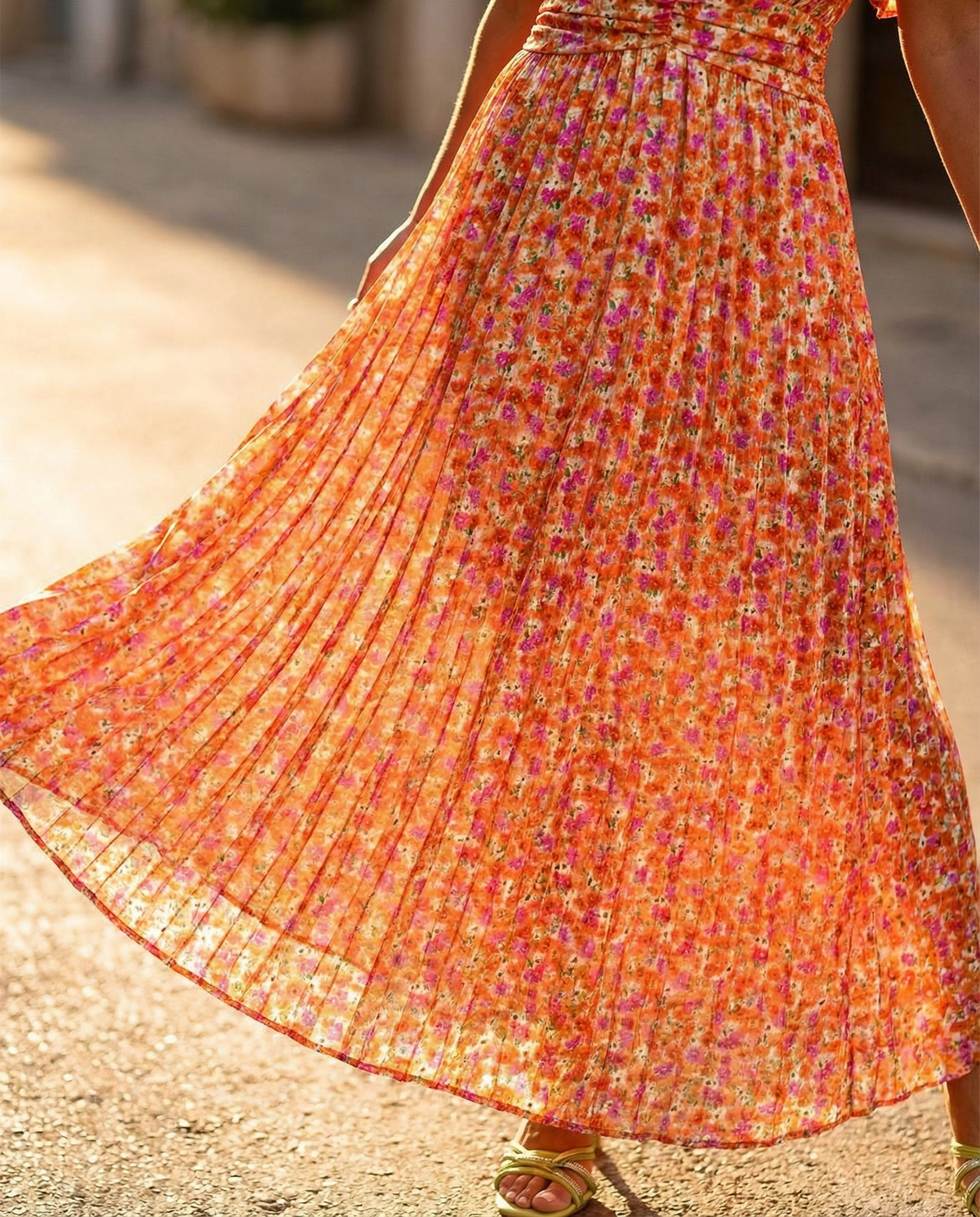 Orange floral maxi skirt with pleated flare hem and gathered waist