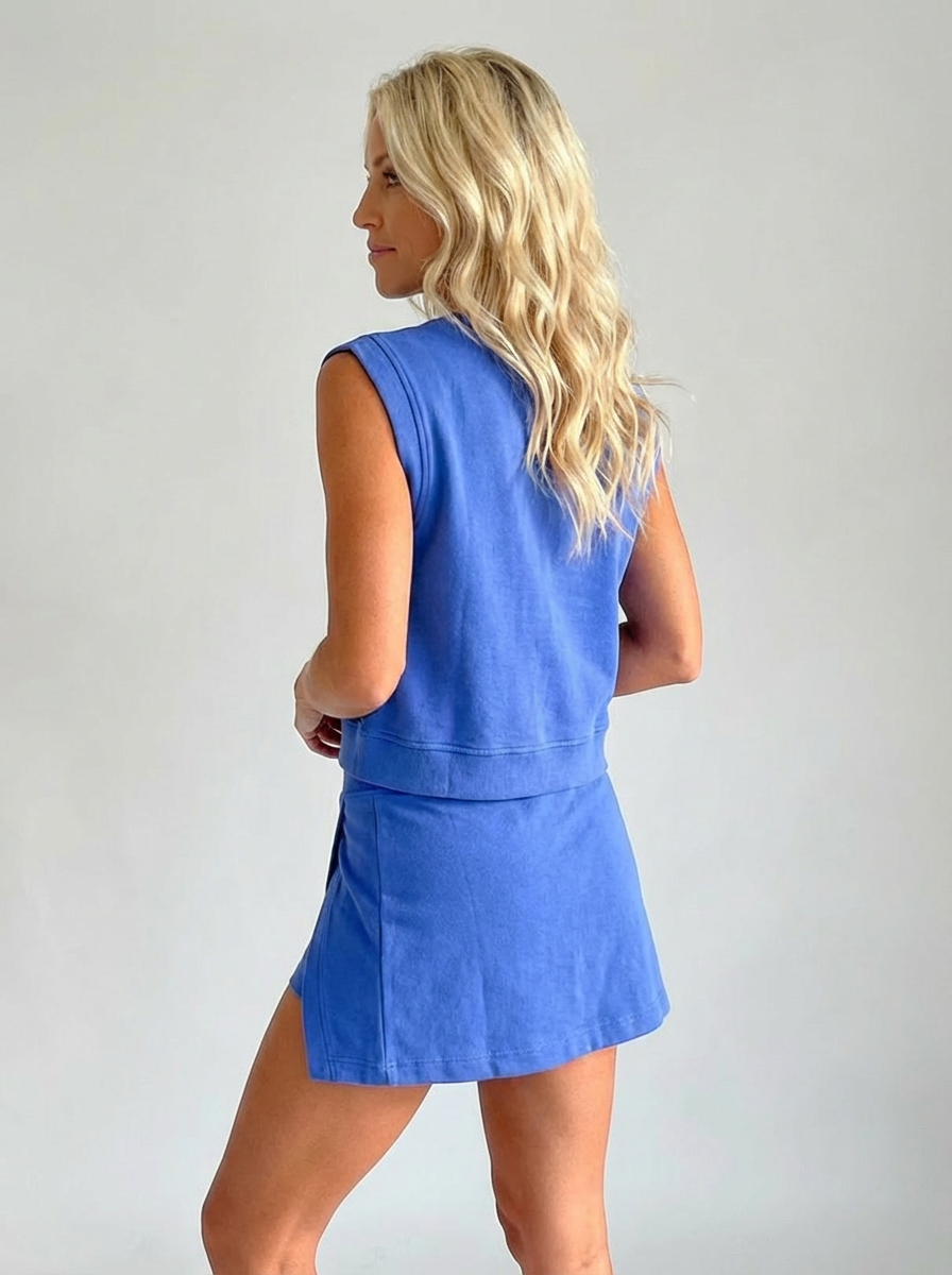 Klein blue sleeveless crewneck top and matching short set, back view with side slit