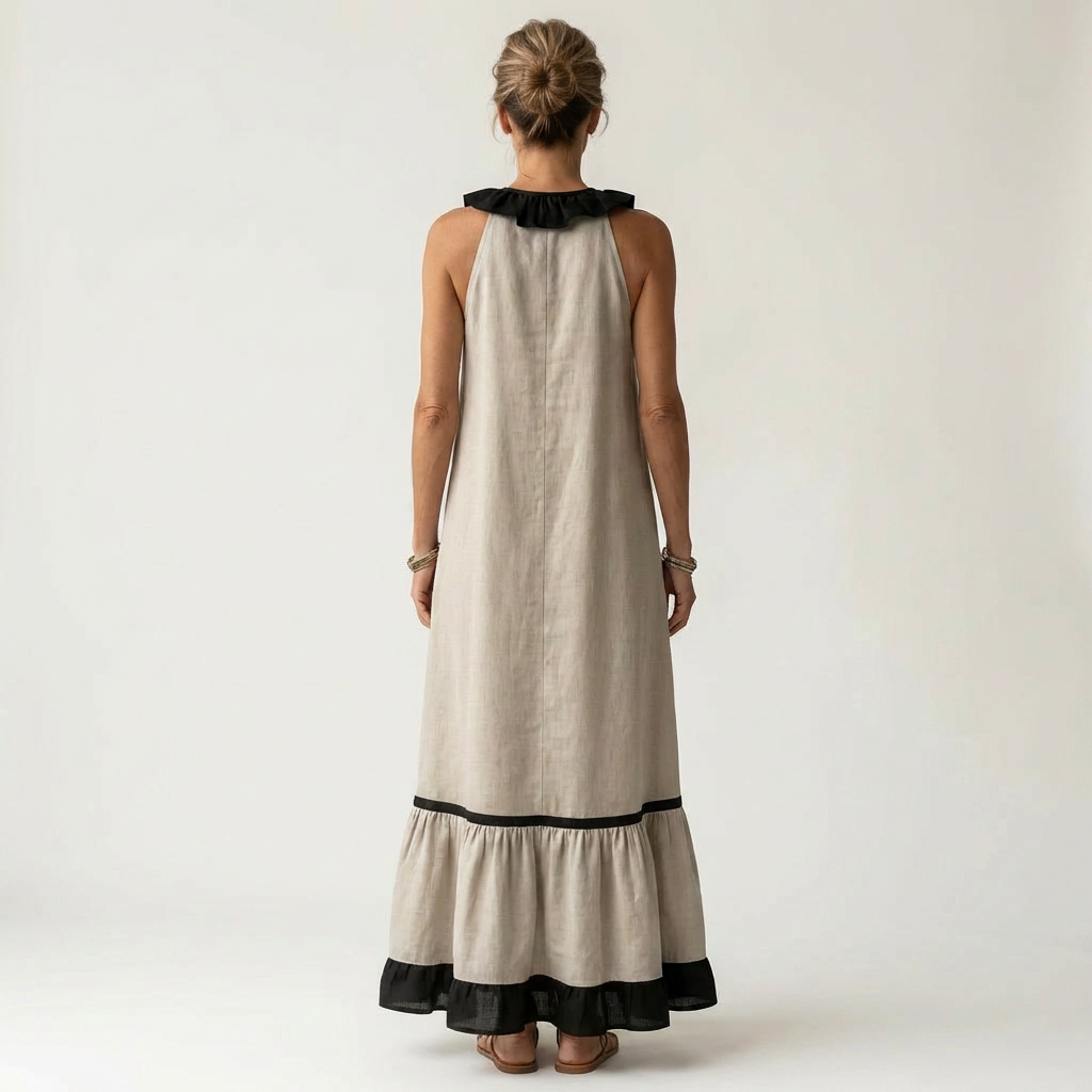 Sleeveless maxi dress back view: off-white with black contrast neckline and tiered hem