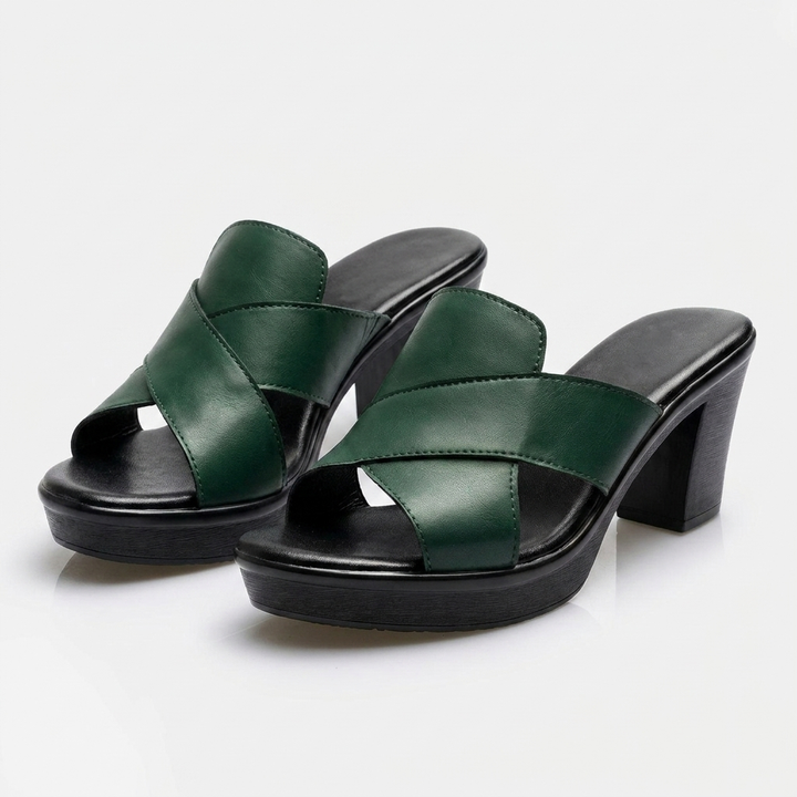 Green platform heeled slide sandals with crisscross straps and chunky block heel