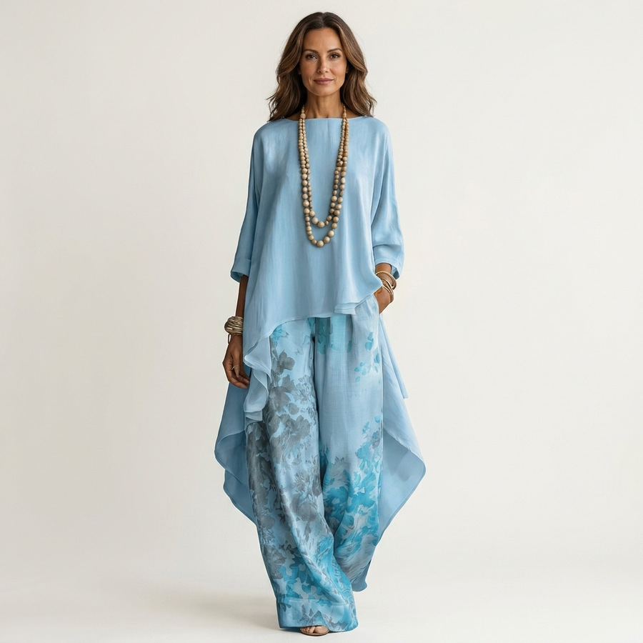 Sky-blue draped tunic top with beaded V-neck and matching floral wide-leg pants
