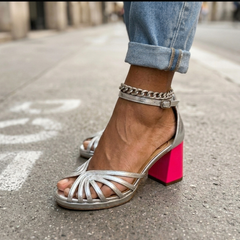 Silver heeled sandals with crisscross straps, chain ankle, and block heel