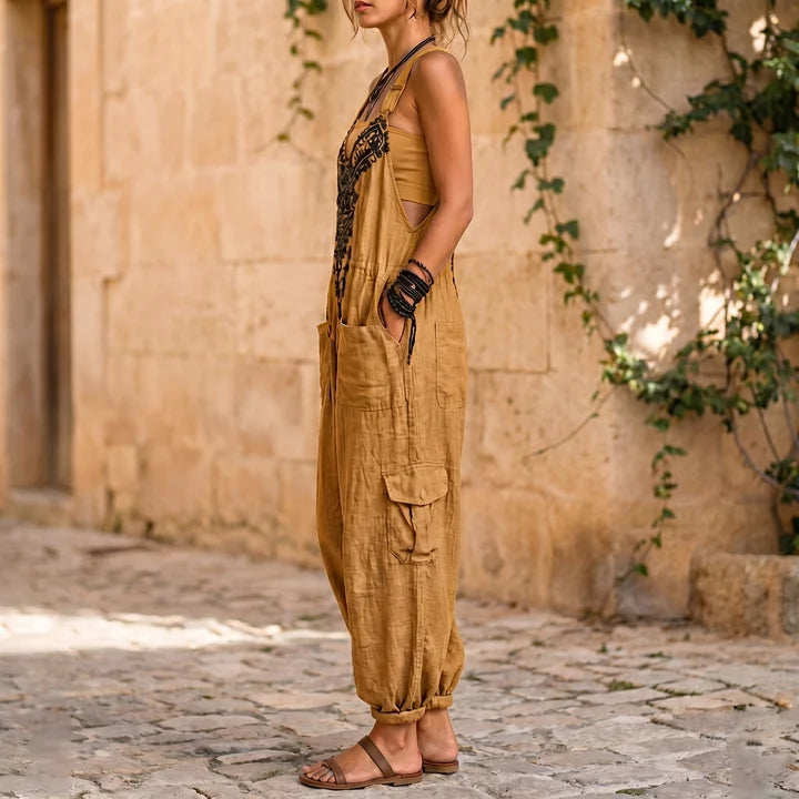 Mustard sleeveless overalls jumpsuit with side pockets and embroidered straps