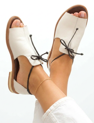 Cream leather strap-style sandals with ankle lace tie and open toe