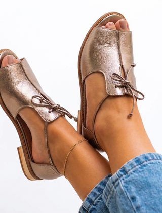 Metallic bronze leather sandals with lace-up ankle strap and thick sole