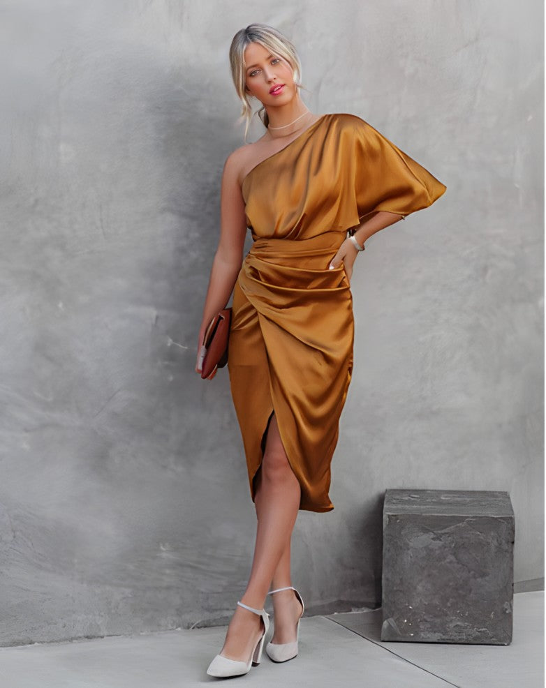One-shoulder satin silk party dress in gold with draped sleeve detail and wrap skirt