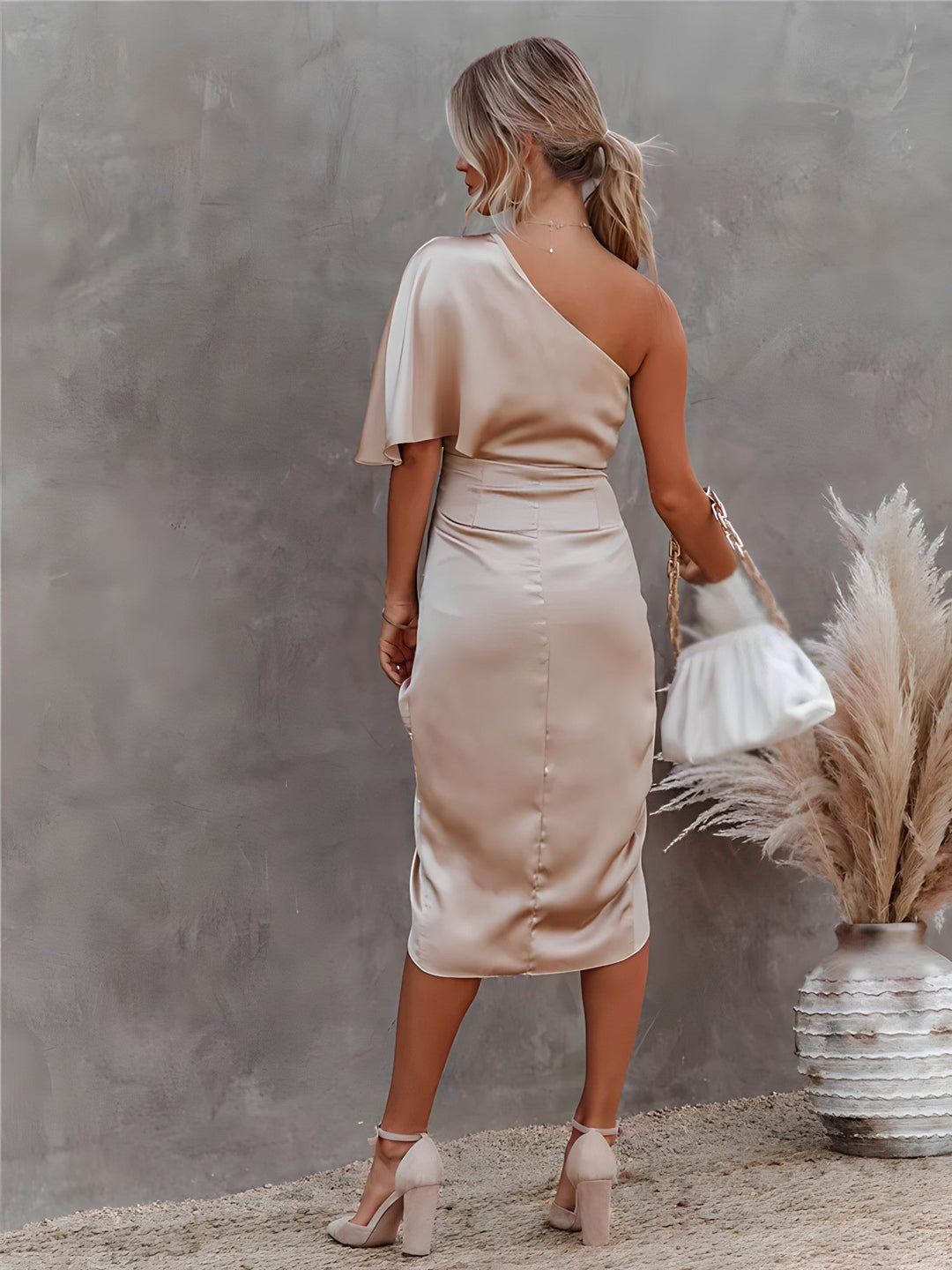 Cream satin one-shoulder party dress with ruched waist and back drape