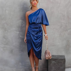 Blue one-shoulder satin dress with draped waist and short cape sleeve, knee slit