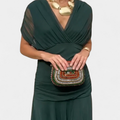 Long dark green V-neck dress with draped cap sleeves and gathered waist