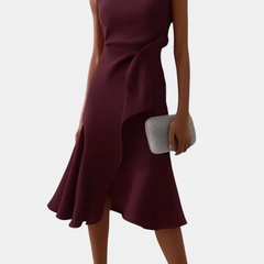 Sleeveless draped asymmetric midi dress in dark plum with diagonal drape and flared skirt