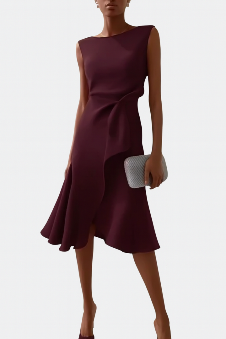 Sleeveless draped asymmetric midi dress in dark plum with diagonal drape and flared skirt