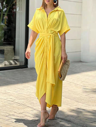 Yellow wrap maxi dress with short sleeves, button front, and tied waist belt