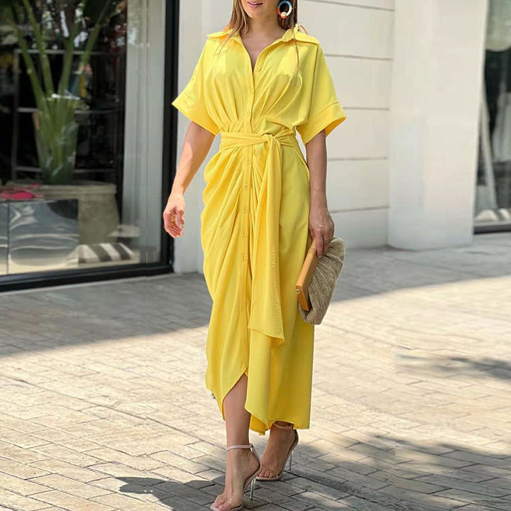 Yellow wrap maxi dress with short sleeves, button front, and tied waist belt