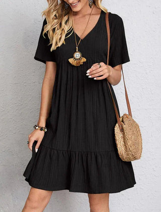 Bohemian casual dress in black, V-neck, short sleeves, tiered ruffle hem