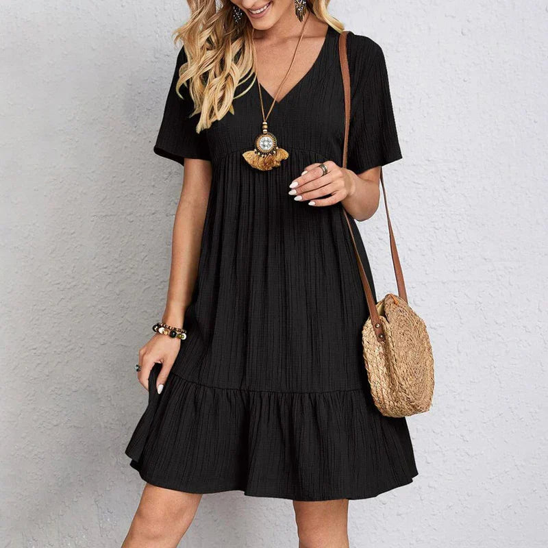 Bohemian casual dress in black, V-neck, short sleeves, tiered ruffle hem