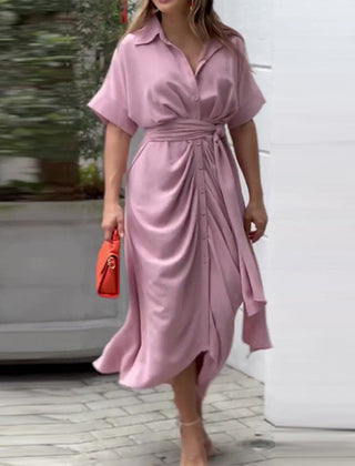 Light pink wrap maxi dress with short sleeves, button front, and tied waist