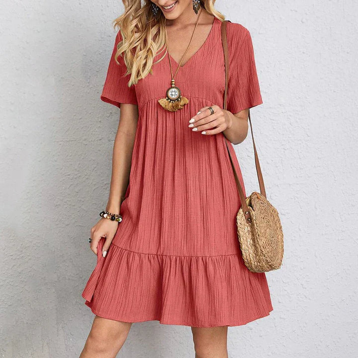 Bohemian casual dress in coral red, V-neck, short sleeves, tiered ruffle hem