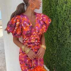 Red and orange abstract midi dress with V-neck and puff sleeves