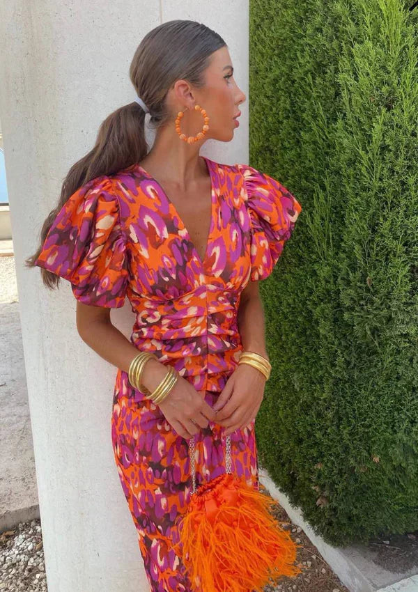 Red and orange abstract midi dress with V-neck and puff sleeves