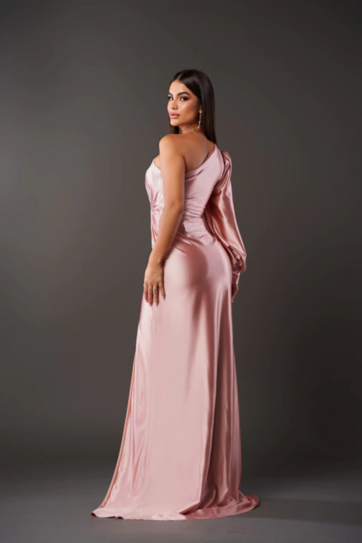 Blush pink one-shoulder satin maxi dress with draped waist and long sleeves